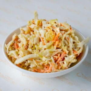 A bowl of coleslaw on the table