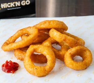 A close up of some onion rings on a plate