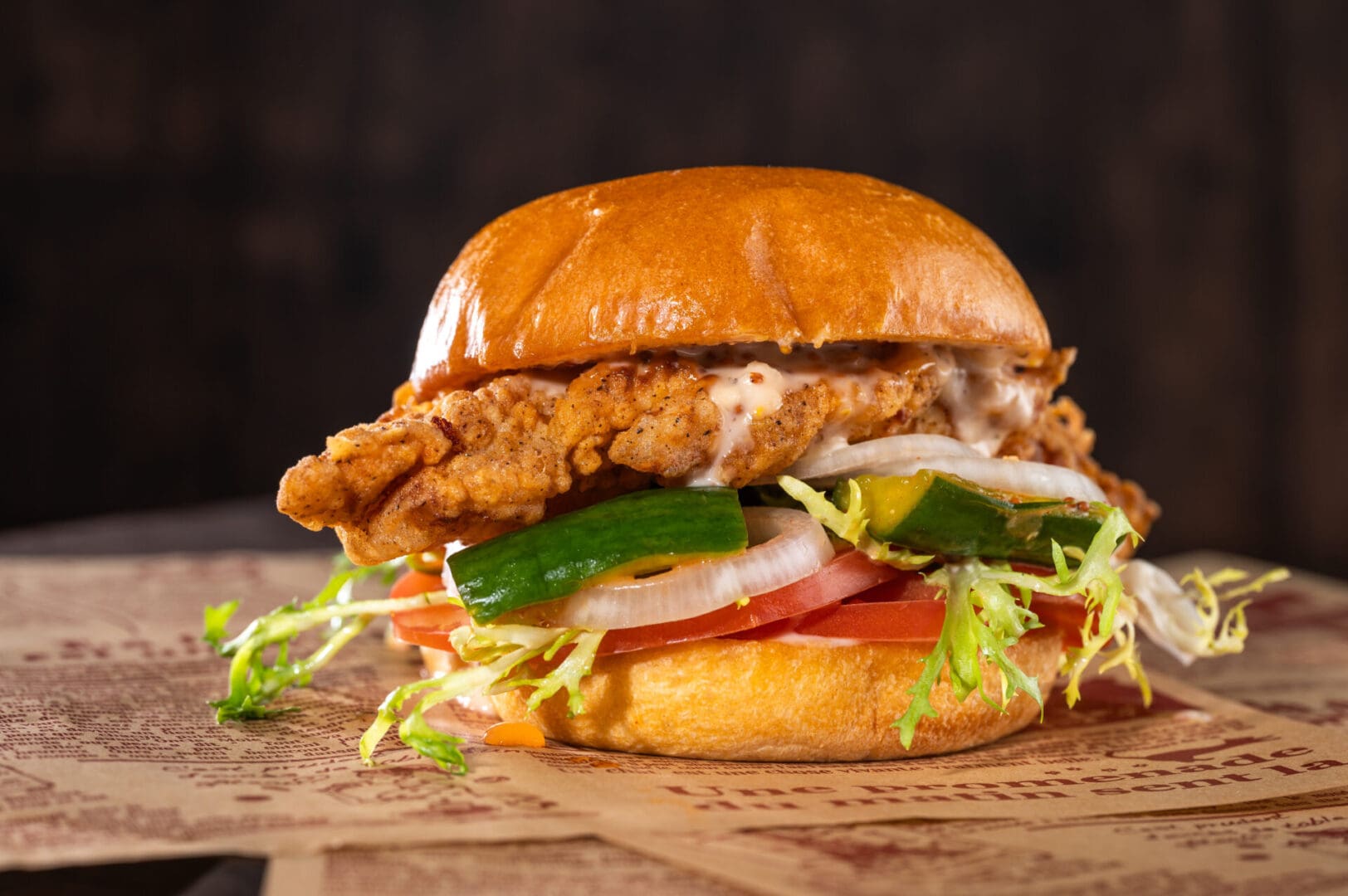 A closeup look at a burger kept on a table.